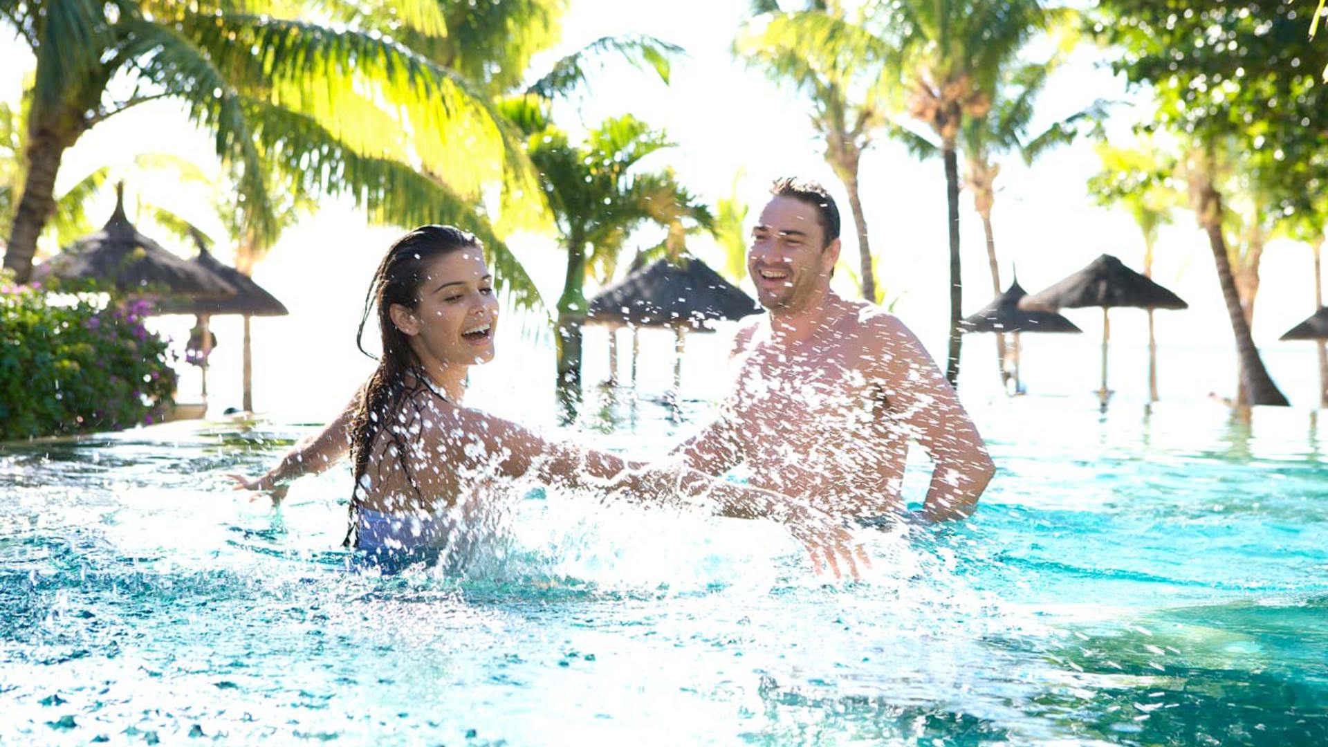 Couple in Oasis pool at LUX* Le Morne